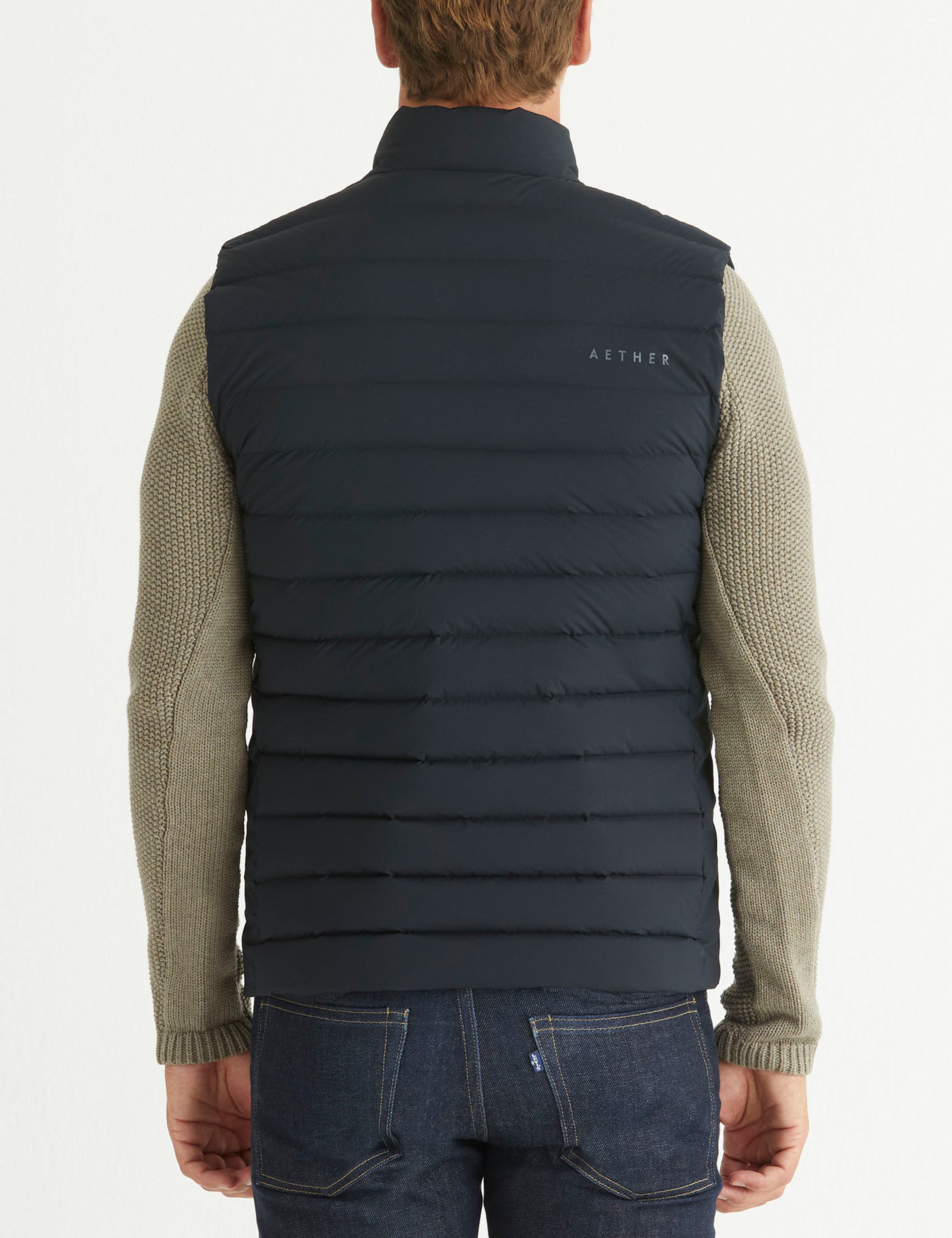 man wearing black insulated vest