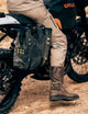 man wearing tan pants sitting on motorcycle