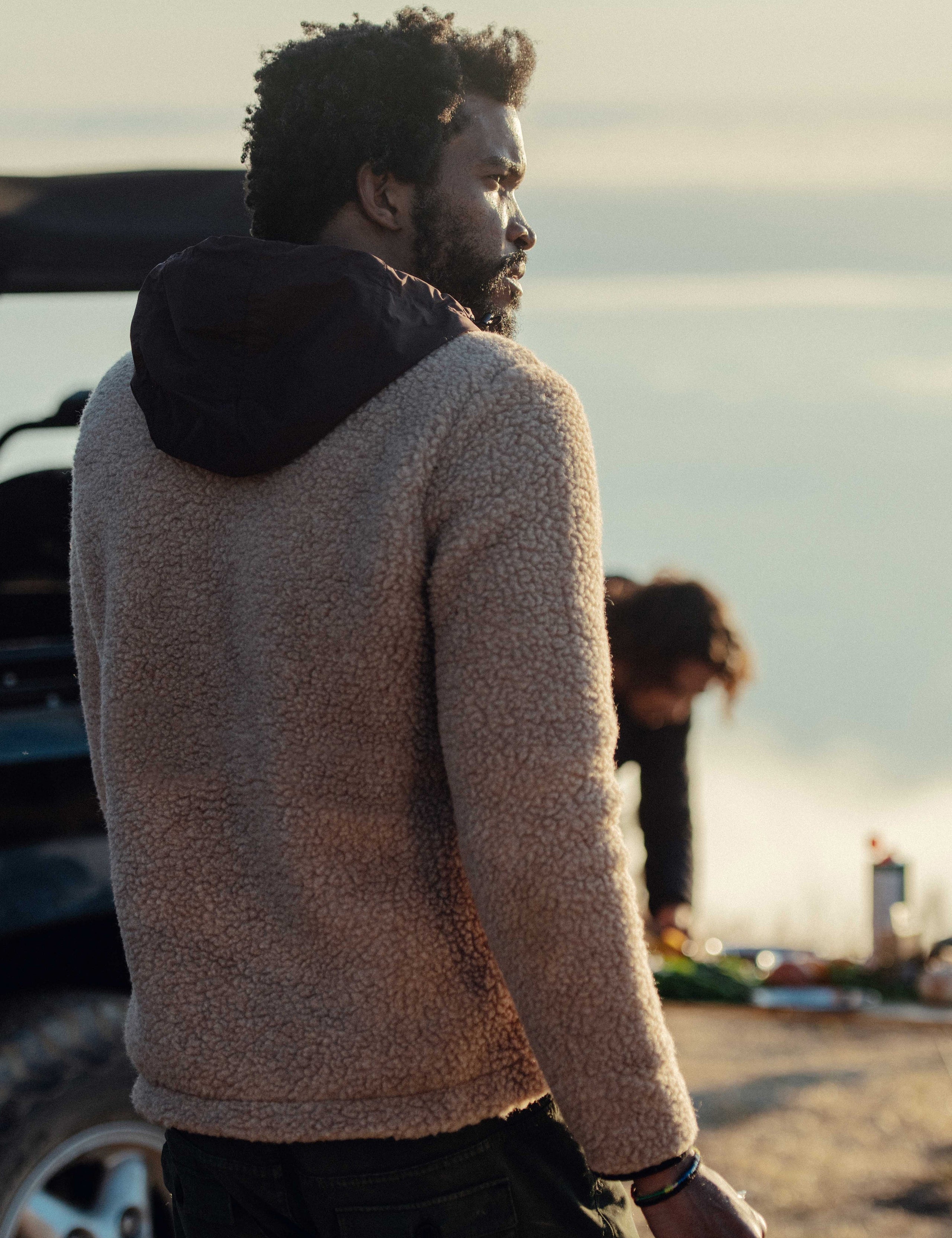 man wearing light brown pullover