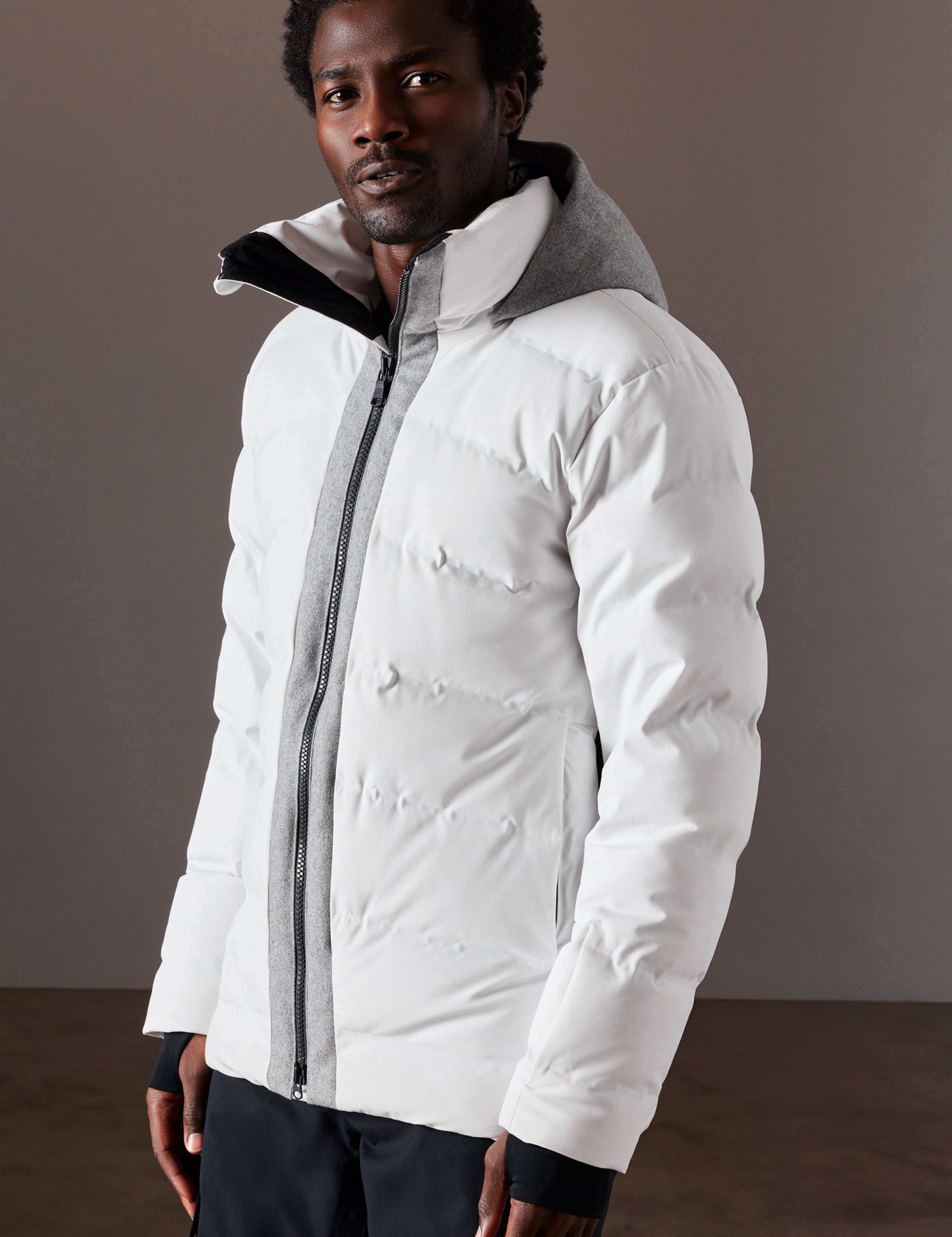 man wearing white ski jacket from AETHER Apparel