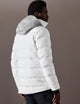 man wearing white ski jacket from AETHER Apparel