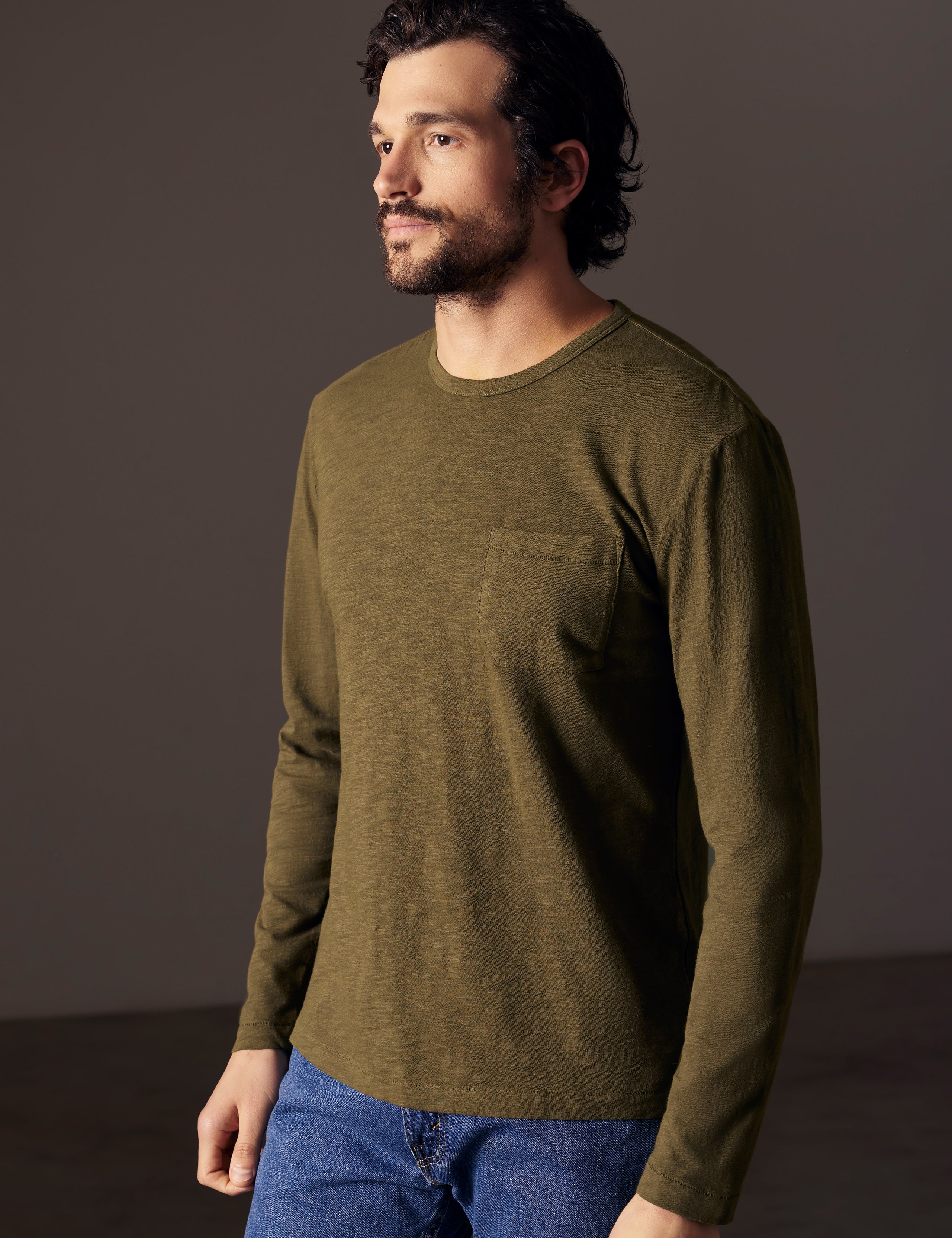 man wearing green long-sleeve tee from AETHER Apparel