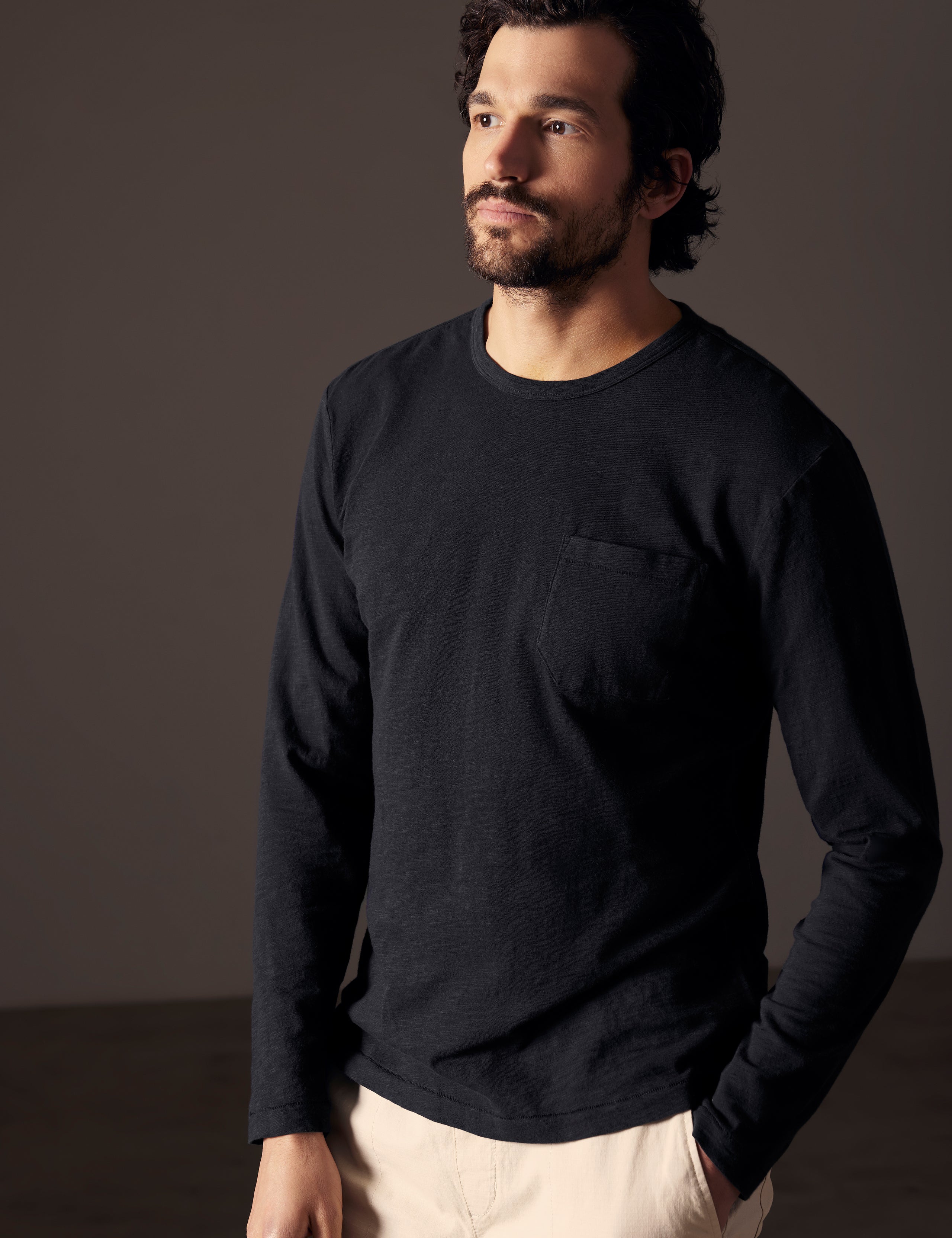 man wearing black long-sleeve tee from AETHER Apparel