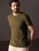 man wearing green tee from AETHER Apparel