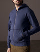 Man wearing blue full-zip hoodie from AETHER Apparel