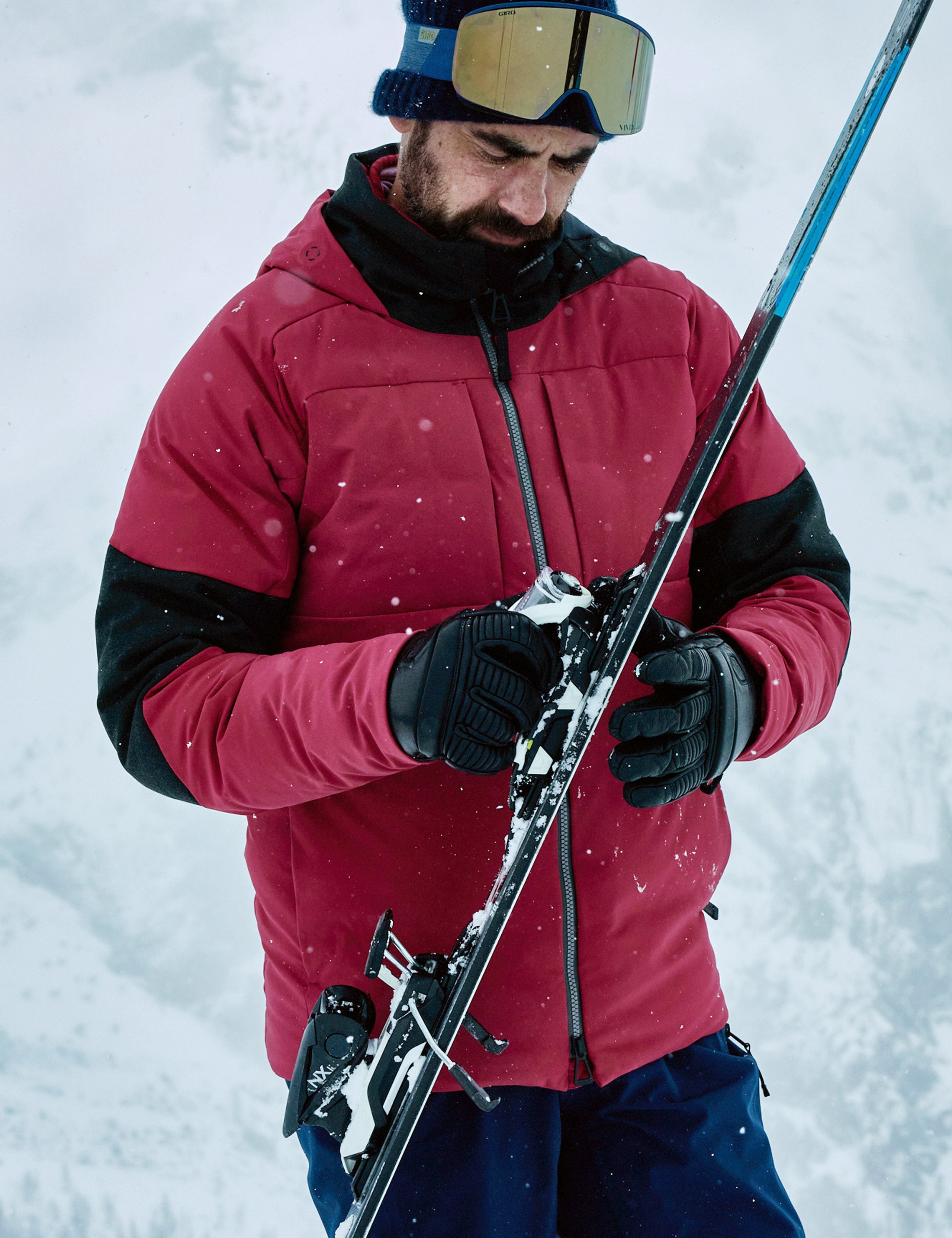 man wearing red ski jacket from Aether Apparel