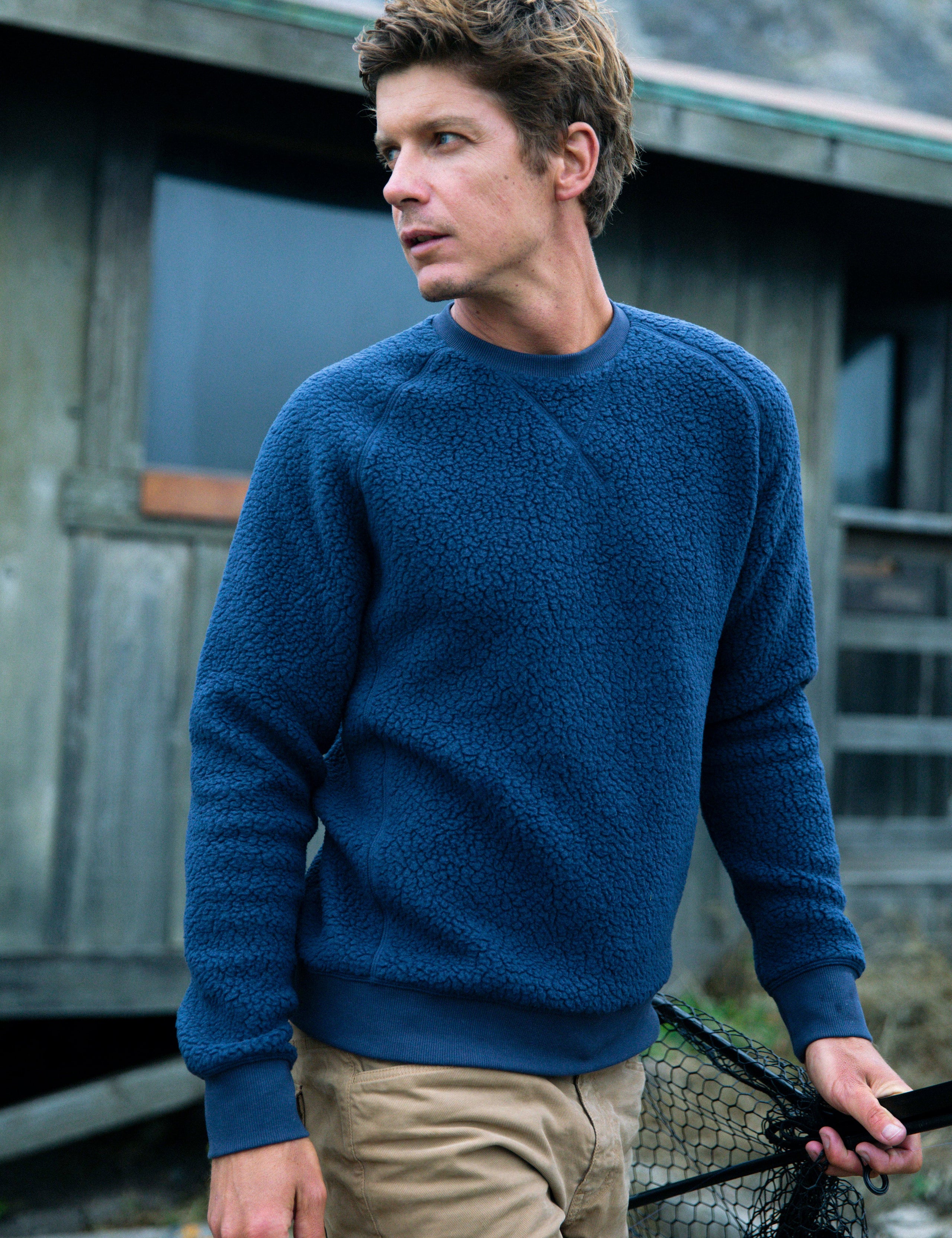 man wearing blue fleece sweater