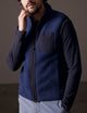 man wearing blue fleece vest