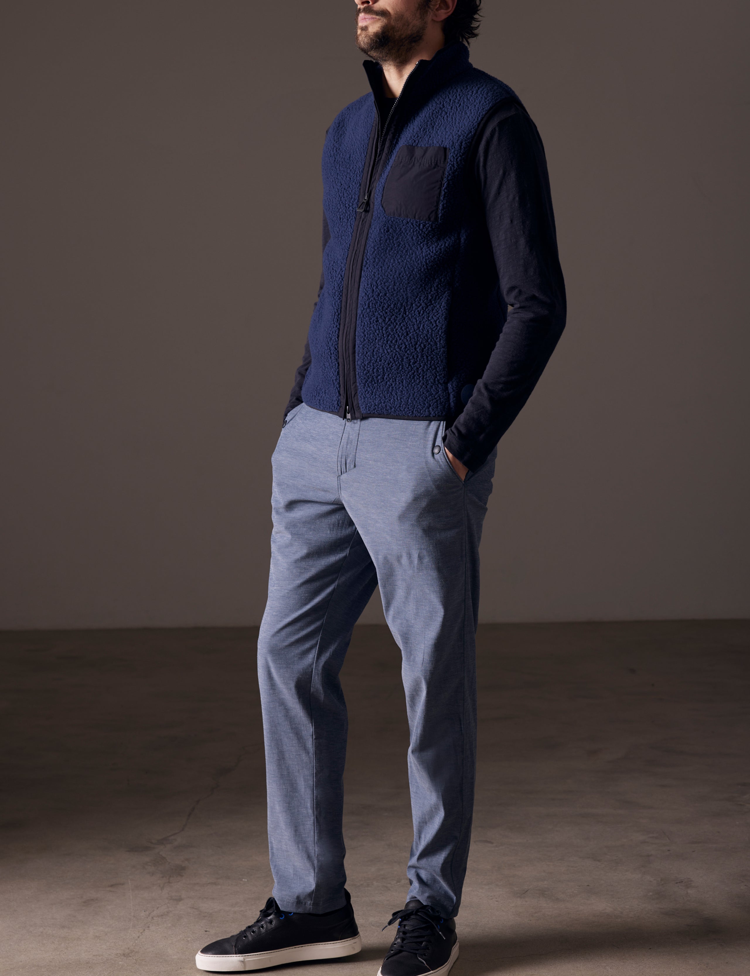 man wearing blue fleece vest