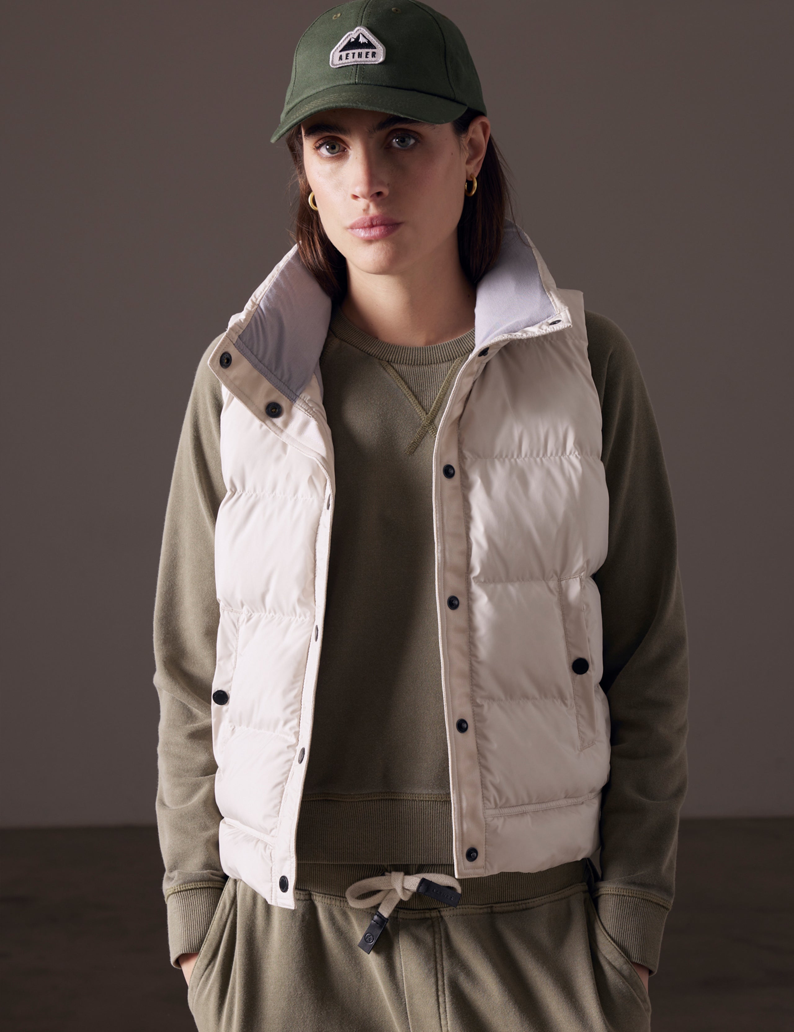 woman wearing beige insulated vest from AETHER Apparel