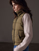 woman wearing green insulated vest from AETHER Apparel