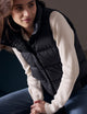 woman wearing black insulated vest from AETHER Apparel