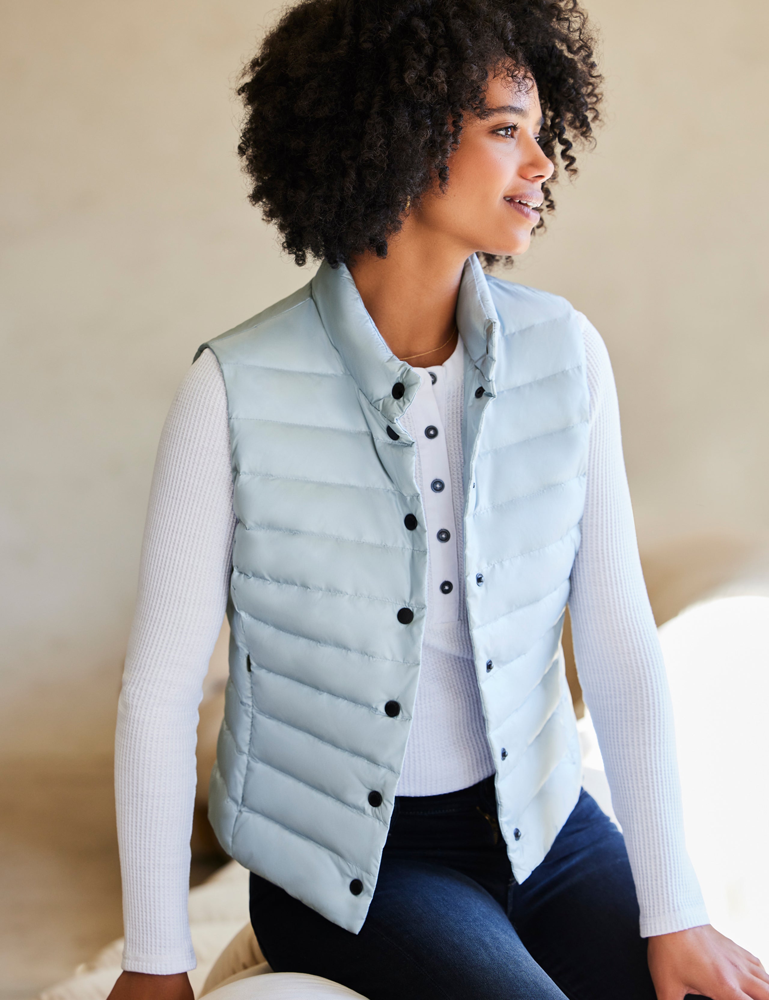 woman wearing blue vest from AETHER Apparel