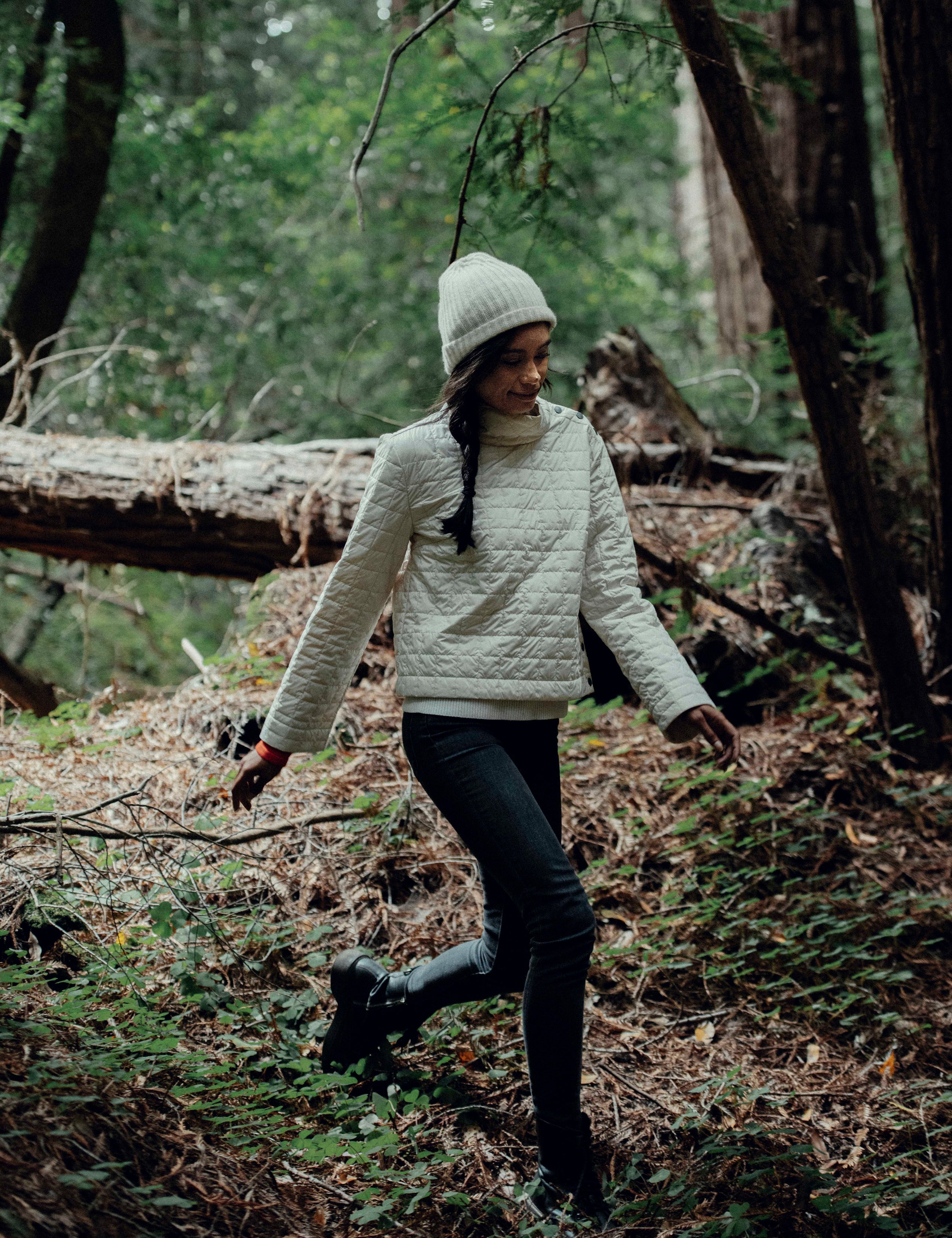 woman wearing quilted beige pullover