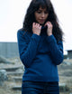 woman wearing blue high neck pullover