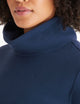 woman wearing blue high neck pullover