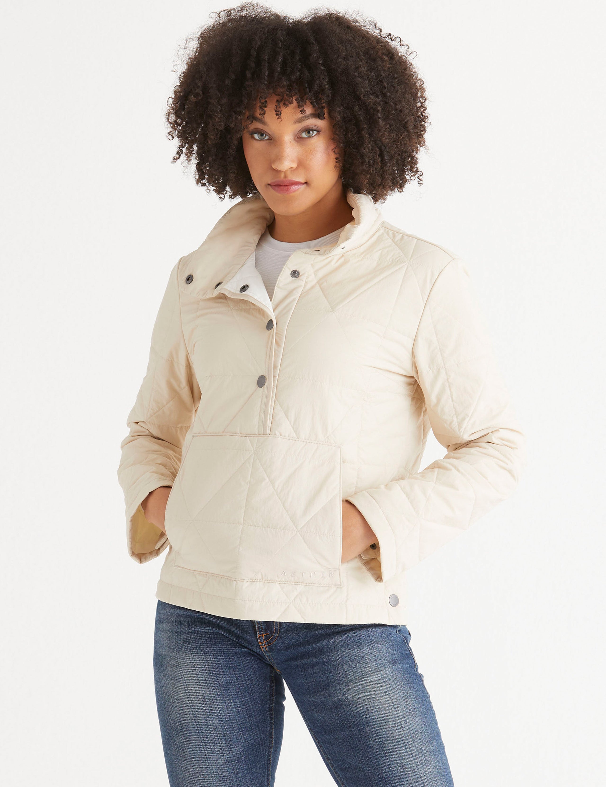 woman wearing light beige pullover