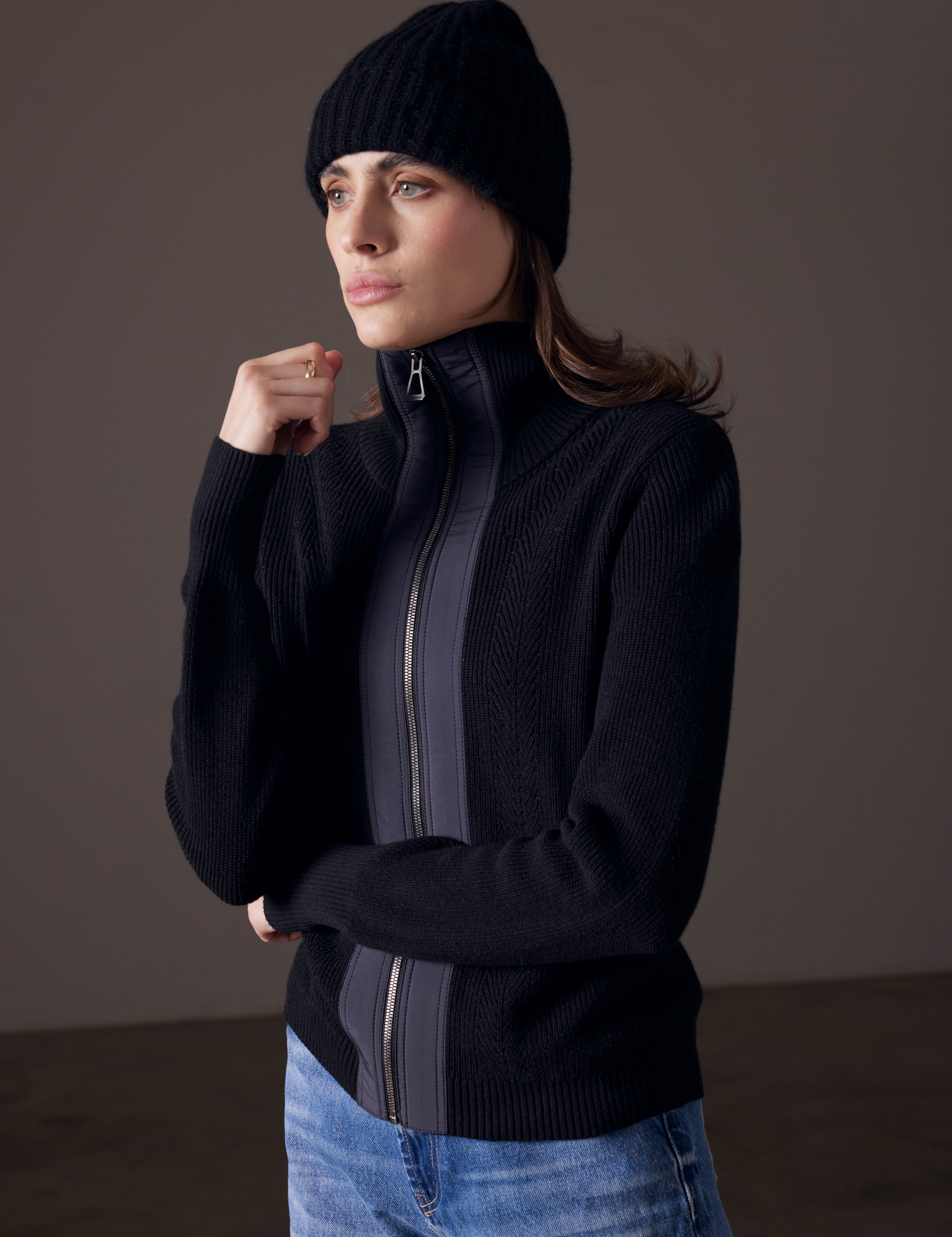 Woman wearing black full-zip cashmere sweater