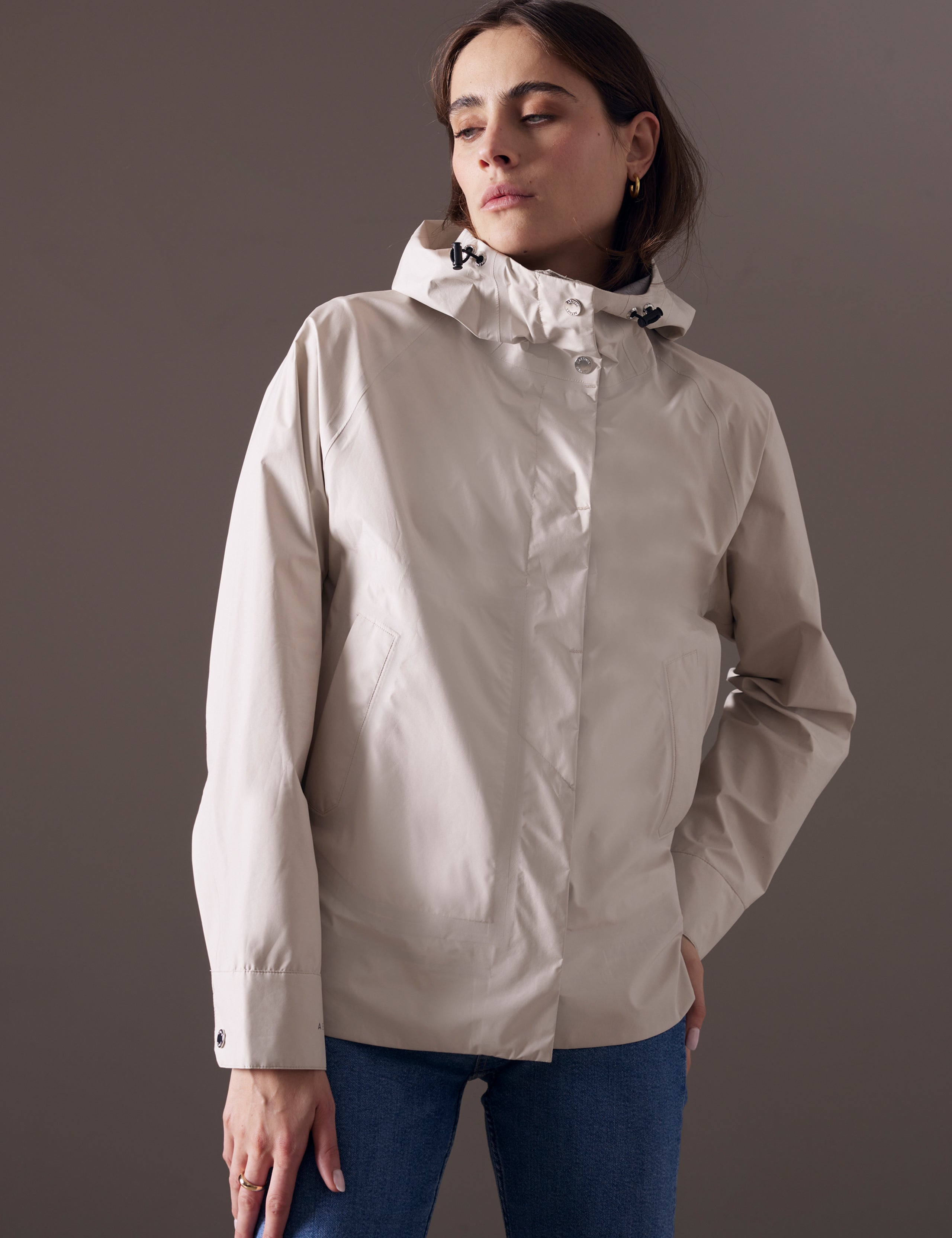 woman wearing beige waterproof jacket