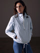 woman wearing light blue anorak from AETHER Apparel