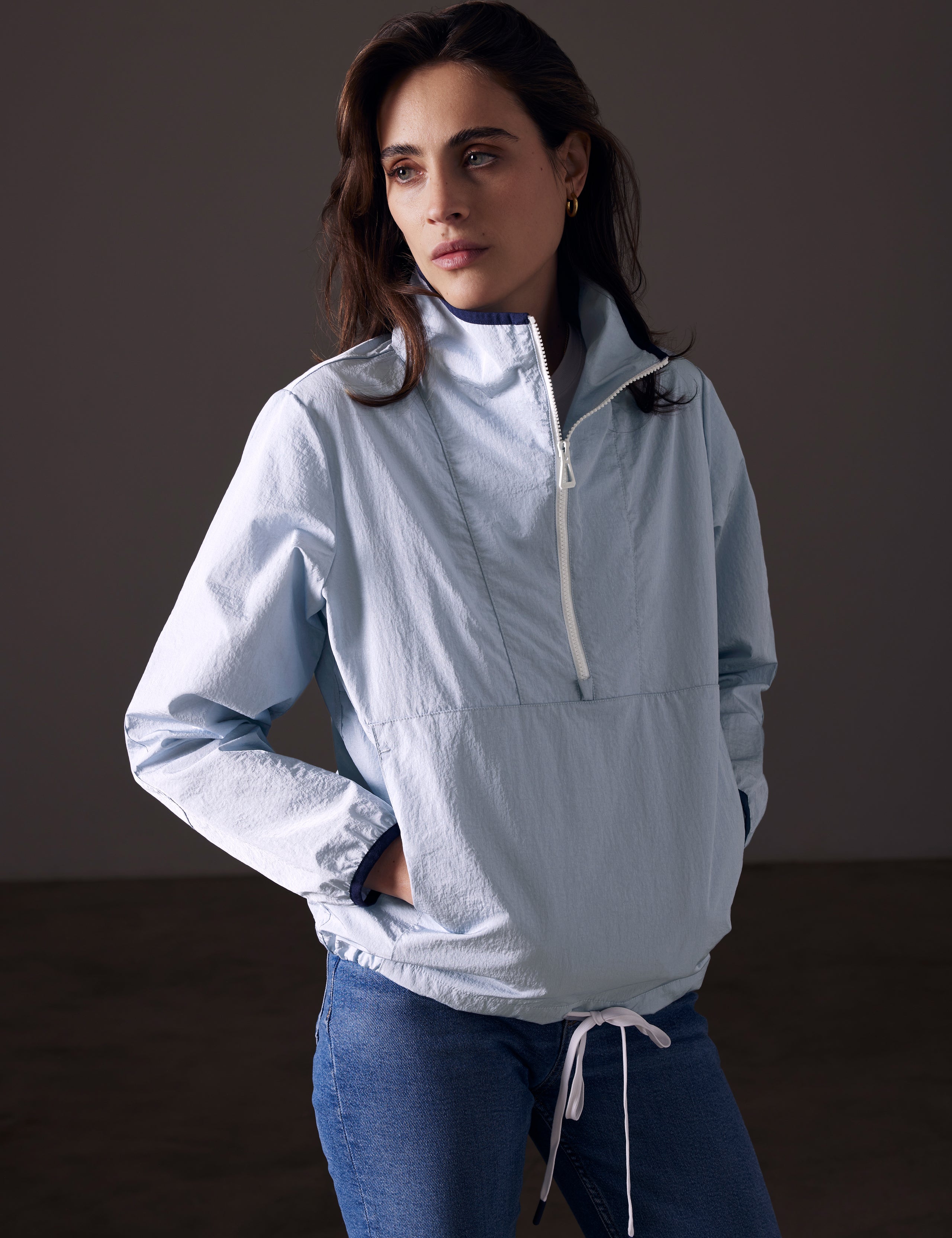 woman wearing light blue anorak from AETHER Apparel