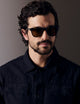 Man wearing green tortoise sunglasses from AETHER Apparel