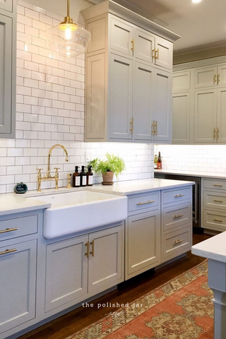 Modern farmhouse kitchen sink counter with The Polished Jar glass bottle soap dispensers