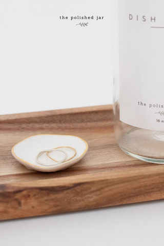 Glass Bottle Soap Dispenser and Ring Dish on a Wood Tray