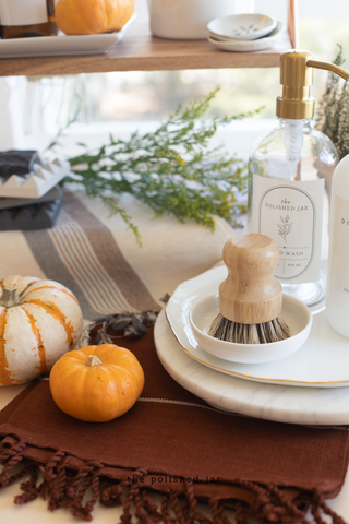 The Polished Jar Clear Plastic Bottle Near Brush and Pumpkins