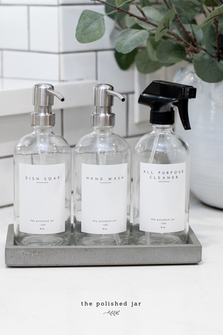 Laundry Room Counter With a Bottle Tray and The Polished Jar Dispensers