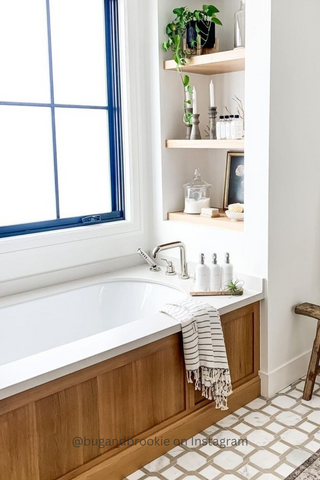 White bathtub with bottle soap dispensers