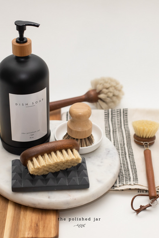 The Polished Jar Soap Dispenser and Brushes on Marble Tray