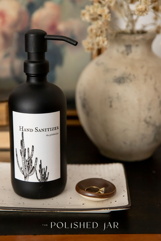 The Polished Jar Bottle Dispenser on Tray next to a ring dish