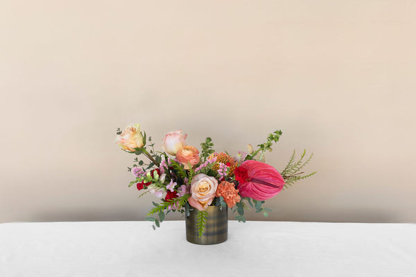 Always Be My Baby Flower Arrangement with pink, orange, and red tones. includes roses