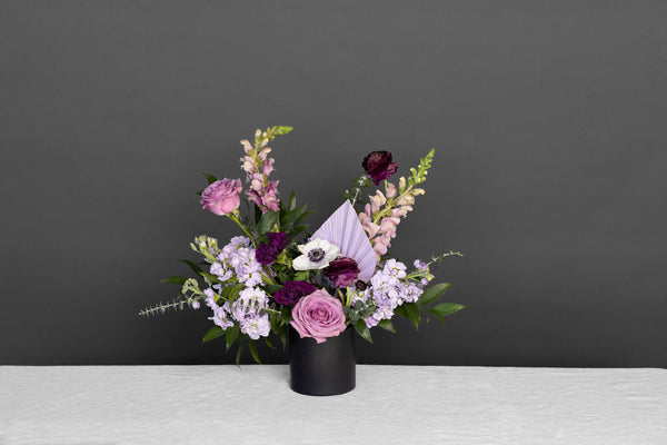 Vision of Love Flower arrangement with different purple toned flowers 