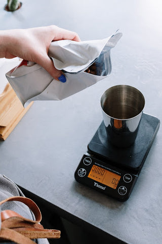 Measuring coffee on digital scale