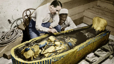 Howard Carter examines the tomb of Tutankhamun