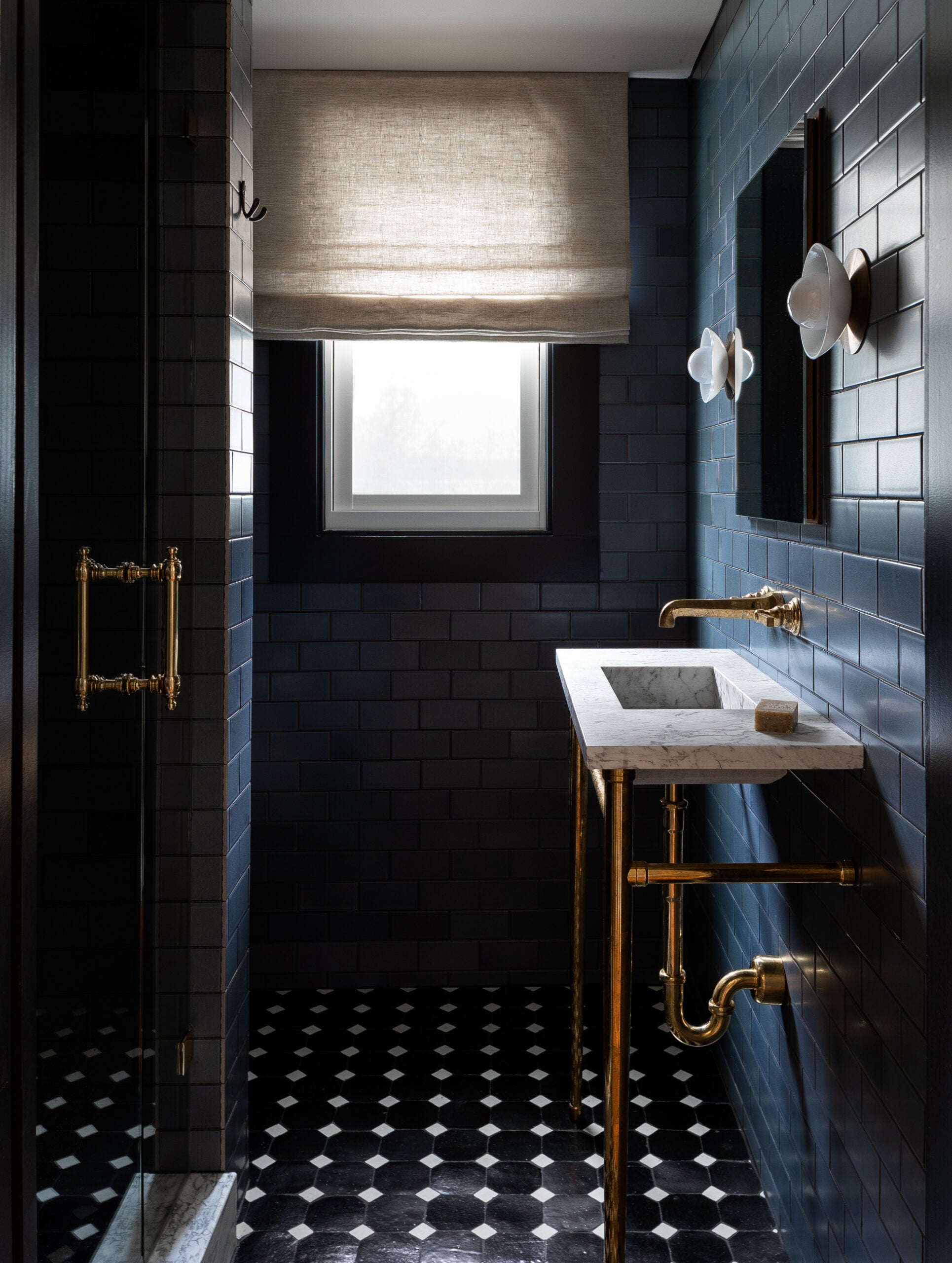 bathroom with black tile