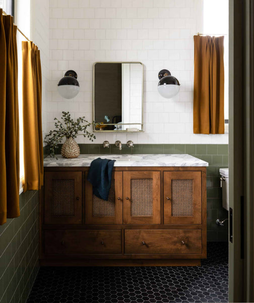 bathroom with green, white, and black tile