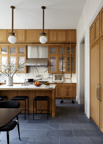 kitchen with wood cabinets and slate tile floors