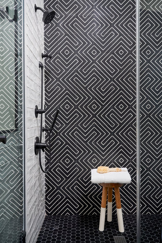 shower with geometric black tile