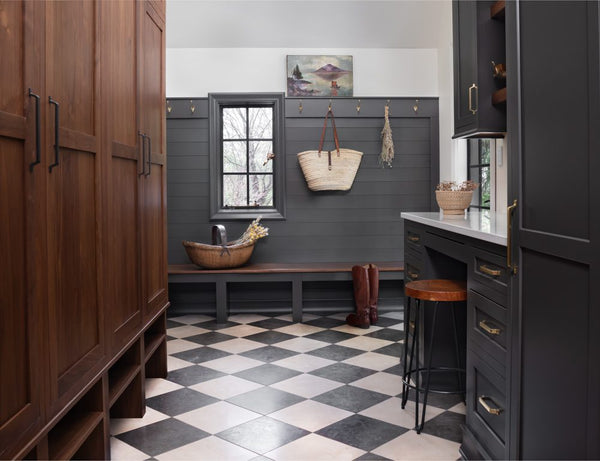 mudroom with black and white checkerboard tile