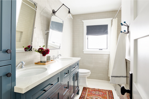 kids bath with subway tile and blue vanity