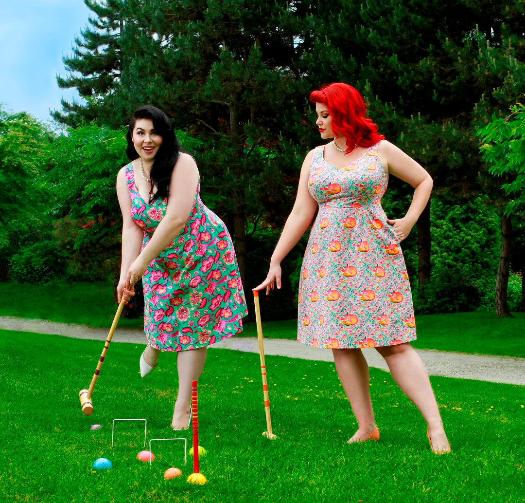 Models wear Cherry Velvet dresses and play croquet