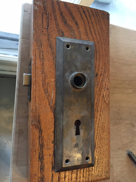 plate over latch