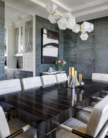 Frosted glass pendant lights over a dining table