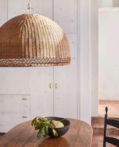 Bamboo/rattan woven pendants over a dining table