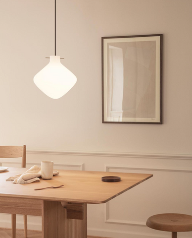 Hand-blown glass pendant over a dining table