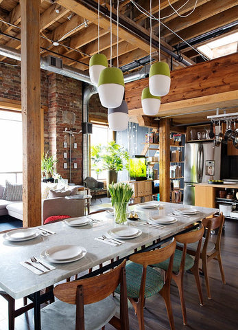 Industrial dining room decor with green plants