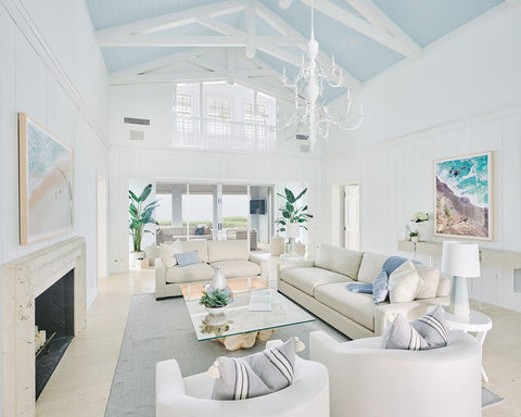 Oversized coastal photography in living room